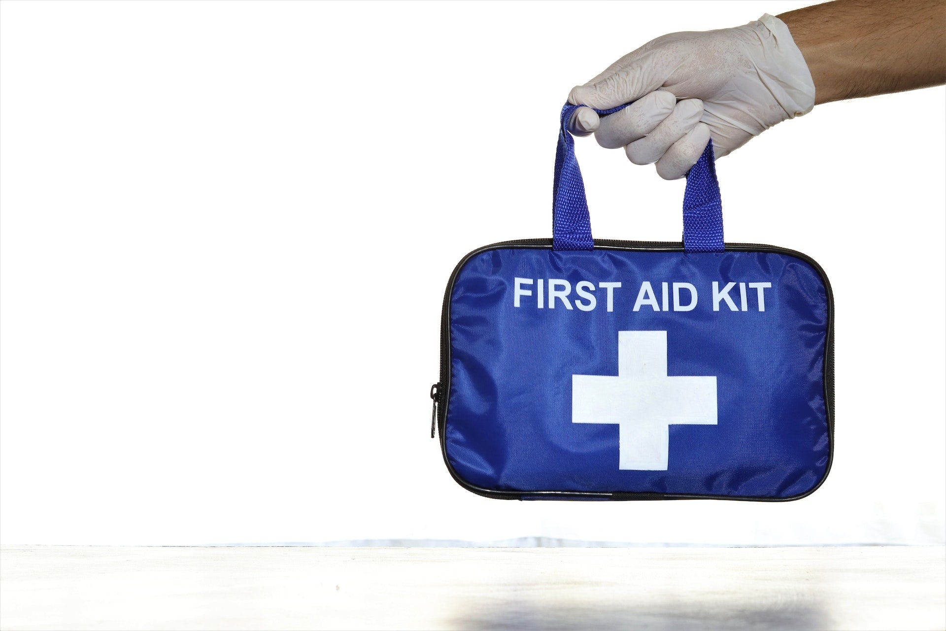 someone holding a first aid kit