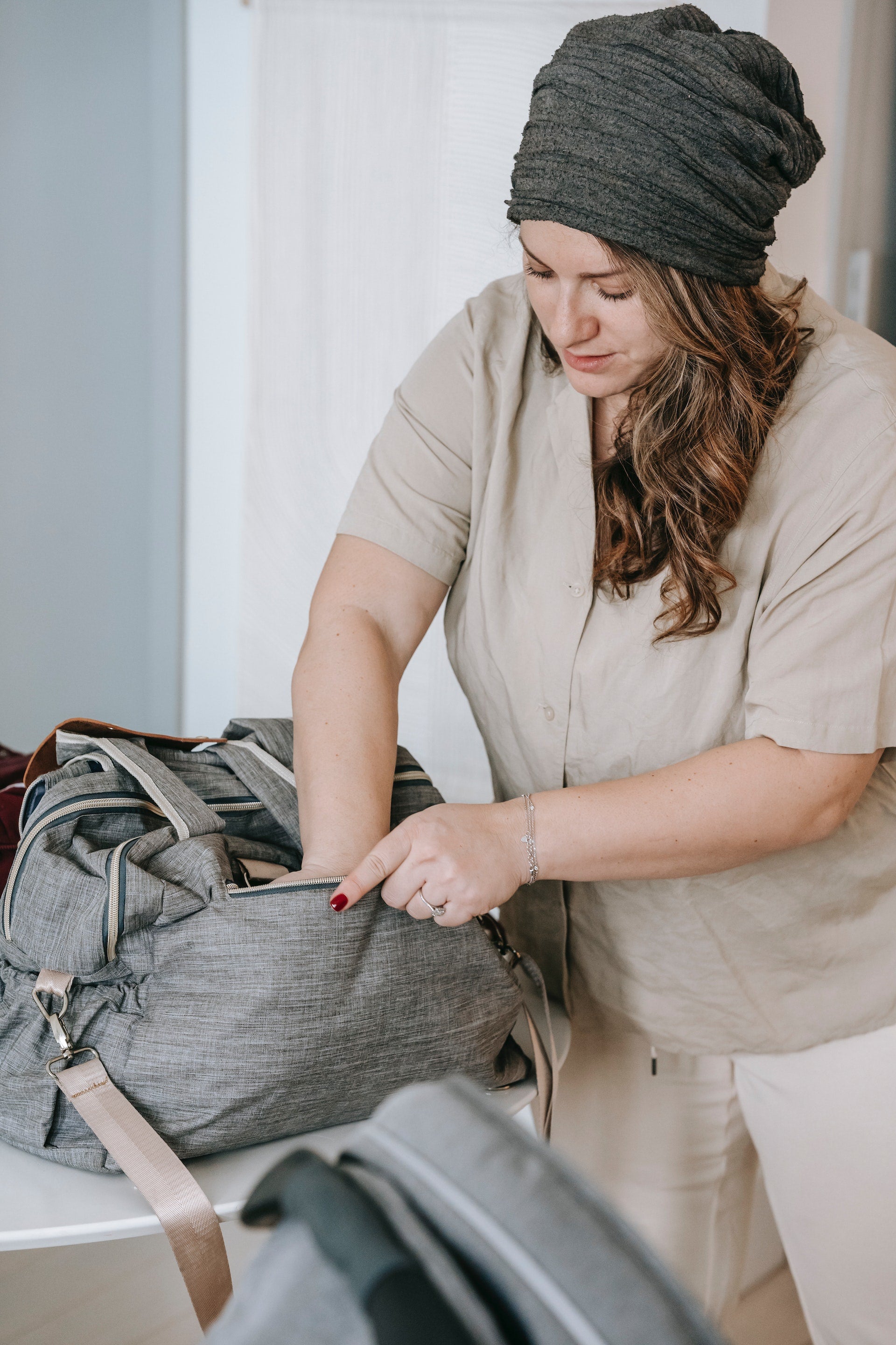 mother packing her breast pump bag