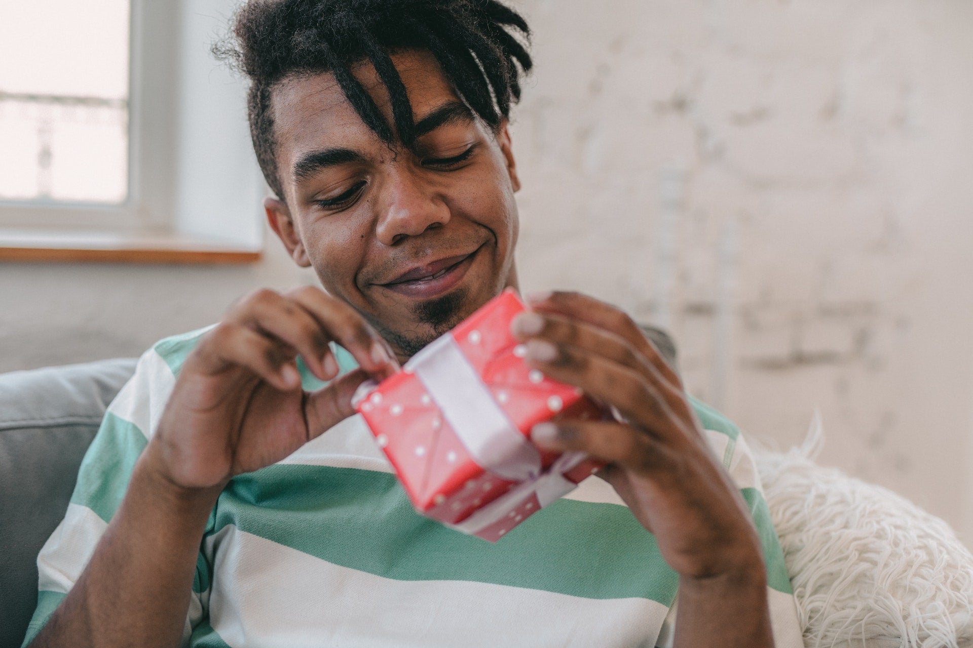 a father opening a gift