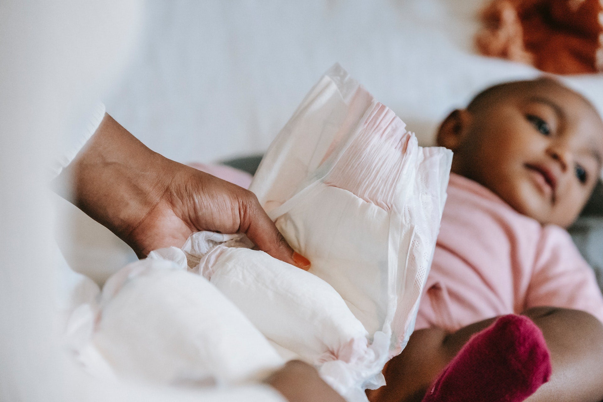 baby having diaper changed