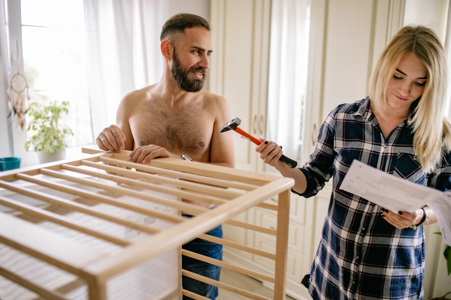 parents building a crib