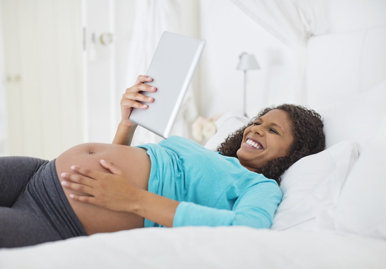 Pregnant lady on tablet