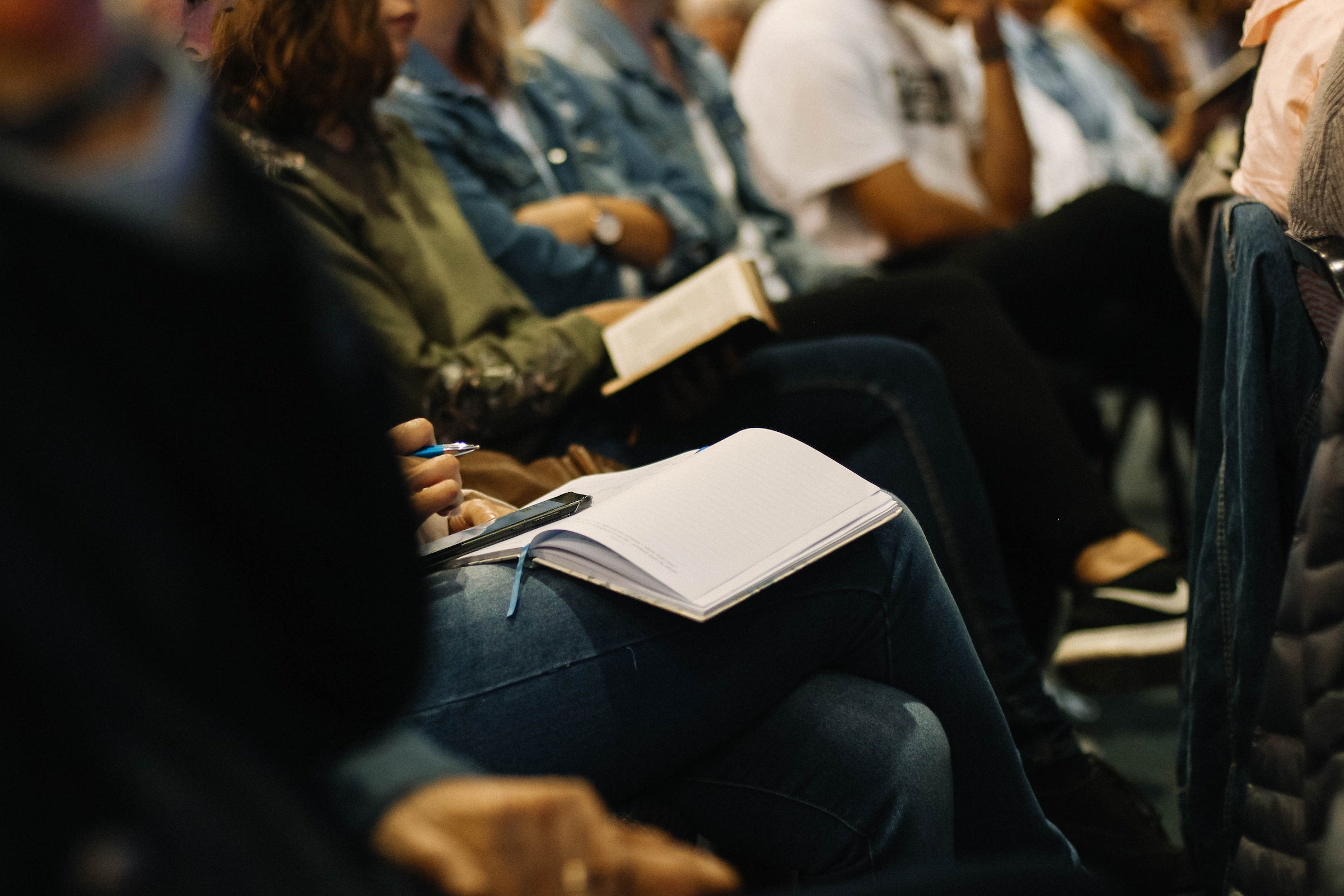 people taking notes in a group