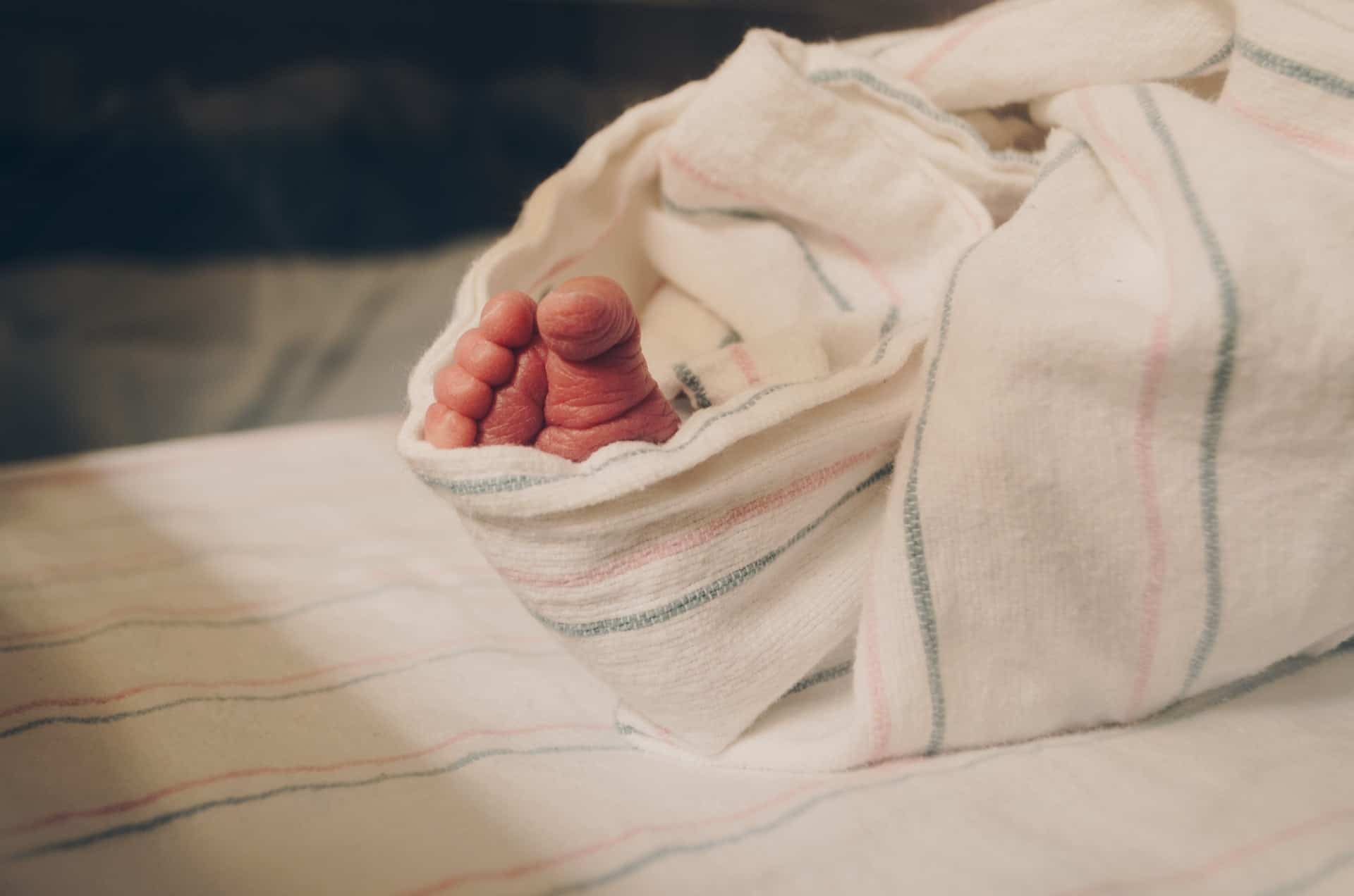 Baby swaddled with toe out  