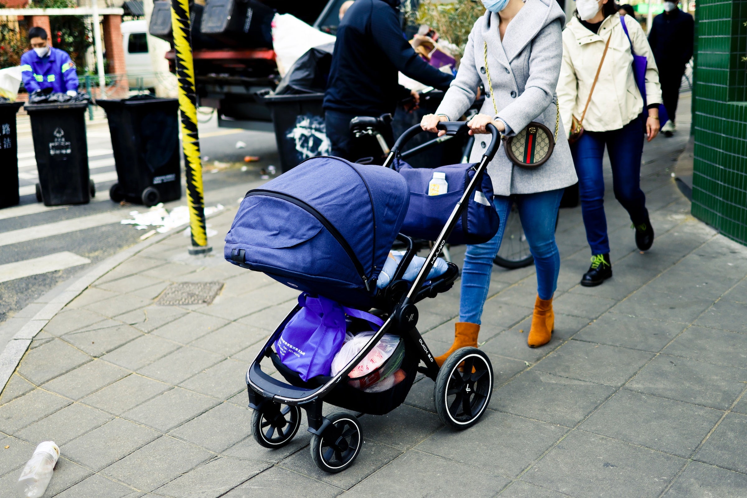 a mom pushing a stroller