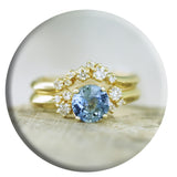 Sapphire and gold ring with scatter diamond wedding band.