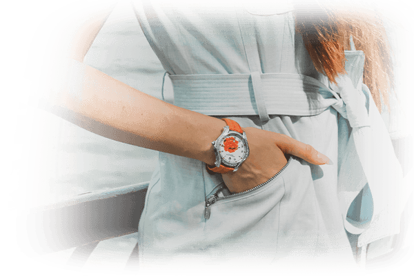 Woman wearing watch with hands in her pocket