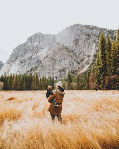 Woman in field with child