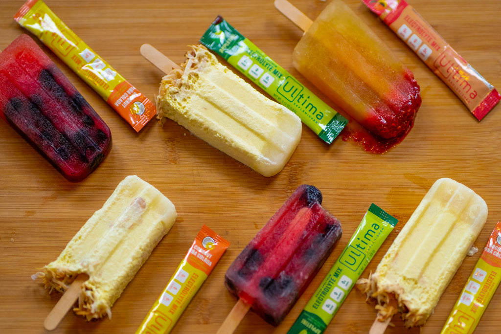 Mexican Paletas made with Ultima Replenisher Electrolyte Hydration Powder laid out with Ultima Replenisher Stickpacks