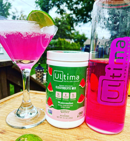 sugar free watermelon cocktail in a glass with ultima replenisher electrolyte powder mix