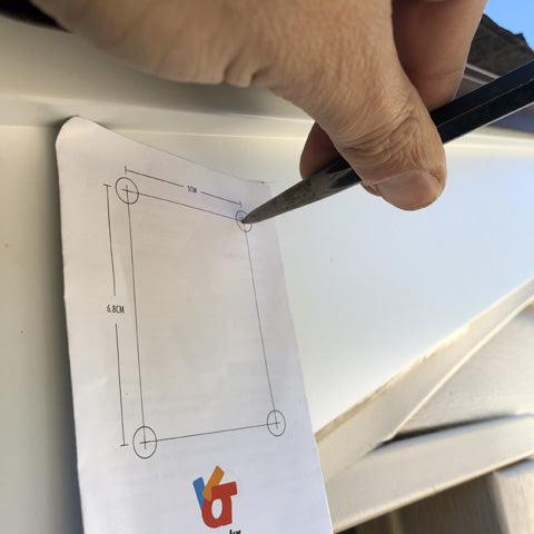 Use JACKYLED Template for location of mounting screws for Solar Security Light On Garage Roof or House