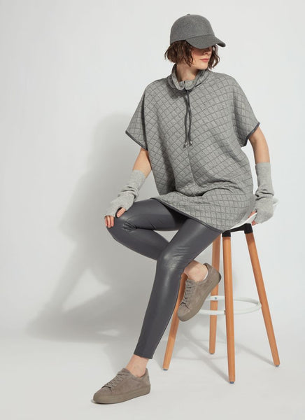 Lyssé charcoal grey faux leather leggings on a model sitting on a chair