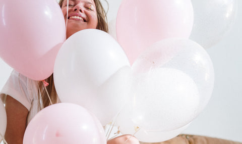 happy woman pink balloon