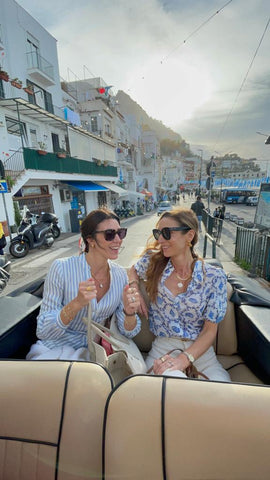 soru sisters in a open topped taxi in capri
