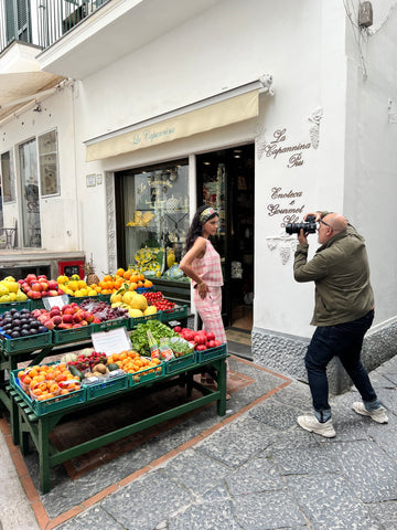 soru capri photoshoot model posing by fruit stand