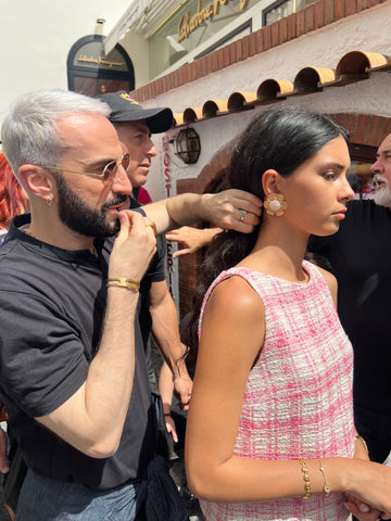 make up artist fixing the model hair at soru capri photo shoot