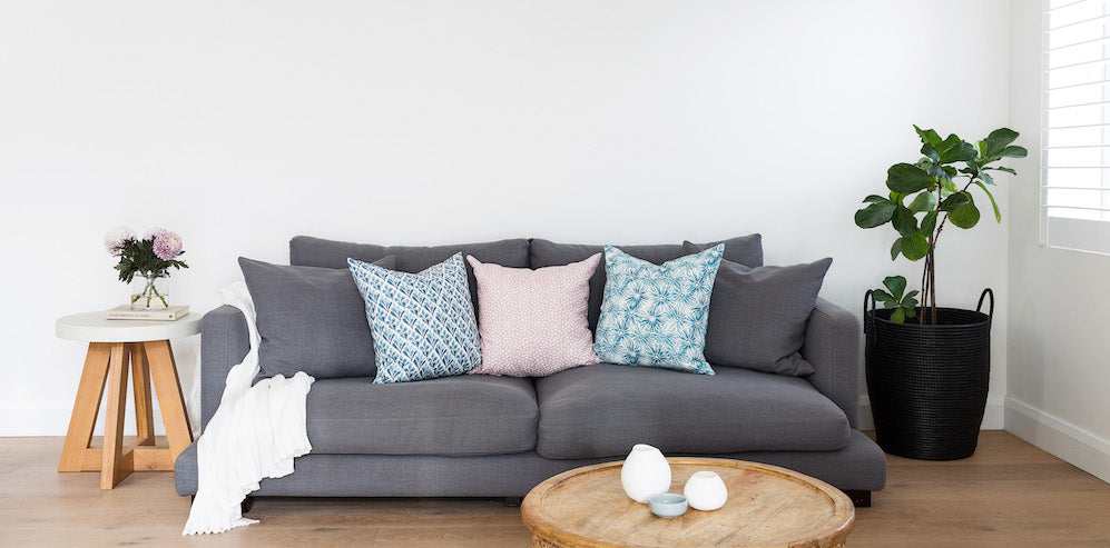 Don’t be afraid to mix prints. Seen here (L to R): Ink Spiller Home cushions in Flora Bluewater, Terrazzo Blush and Aster Teal.