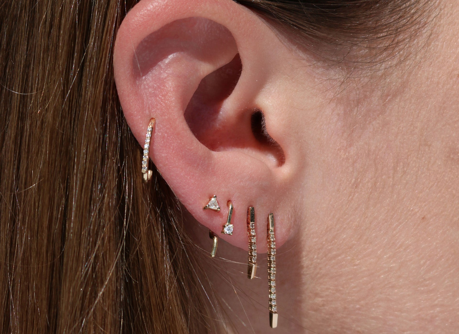 Earrings, lobe piercing, ear stack, conch piercing with diamond earrings.