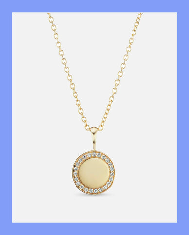 a image of a pendant necklace on a blue background