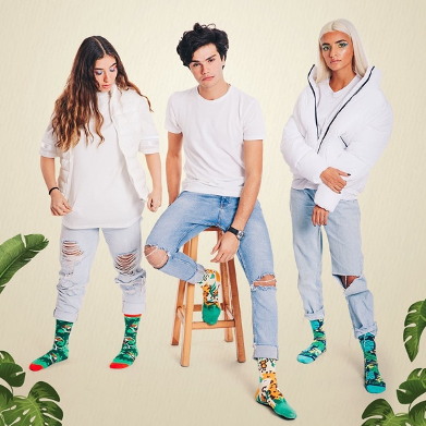 Models wearing crew socks jungle collection from Tale of Socks