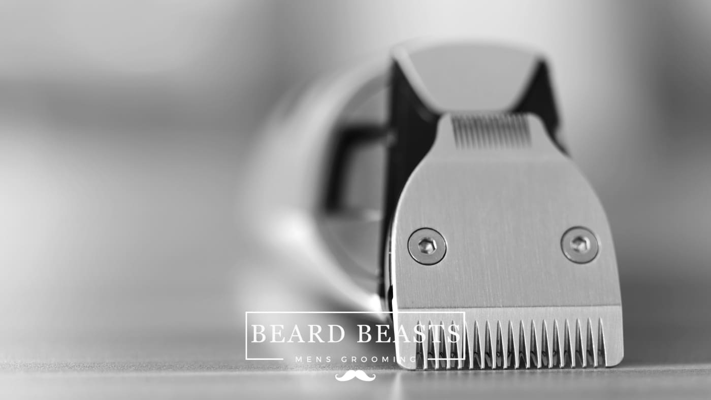 Close-up black and white image of a Beard Trimmer head, showcasing its precise blades for a detailed Ufree Beard Trimmer Review, with the Beard Beasts Men's Grooming logo in the foreground.