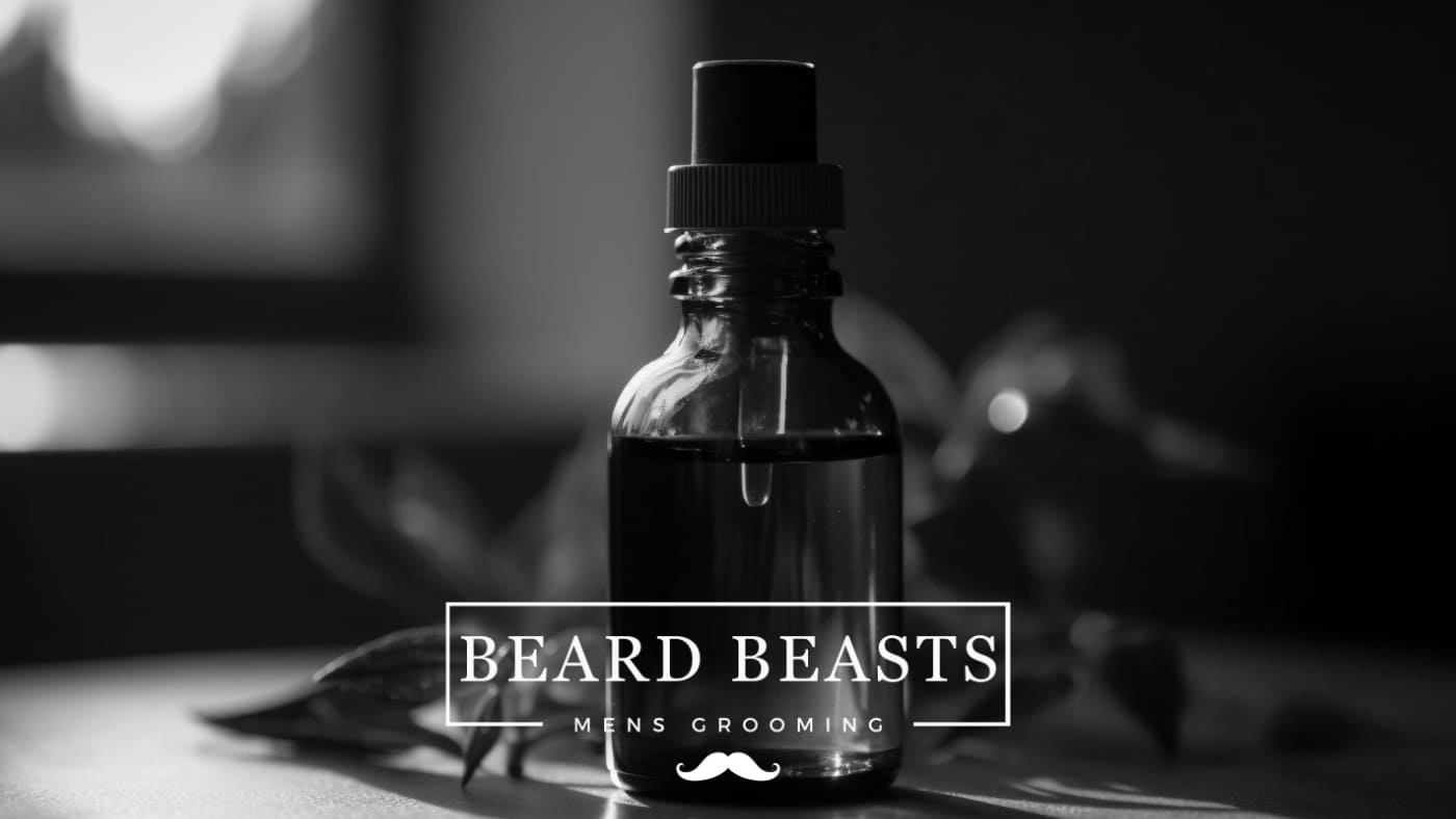 A black and white photo of a Beard Beasts branded beard oil bottle on a blurred background, highlighting the company's logo and the theme of men's grooming.