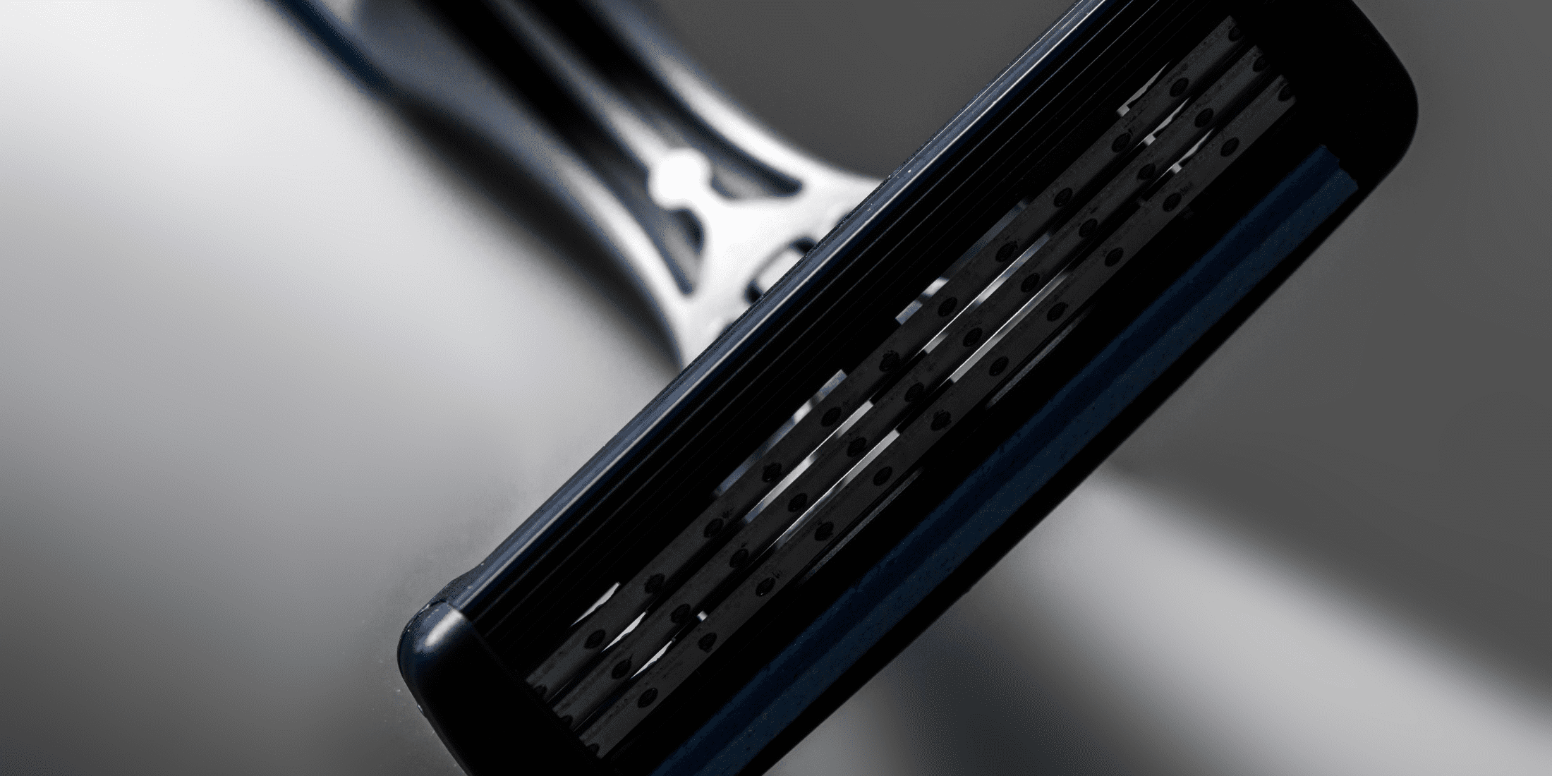 Close-up of a multi-blade razor, highlighting its multiple blades and ergonomic design. Ideal for illustrating the benefits of modern shaving tools in the single blade razor vs multi blade debate