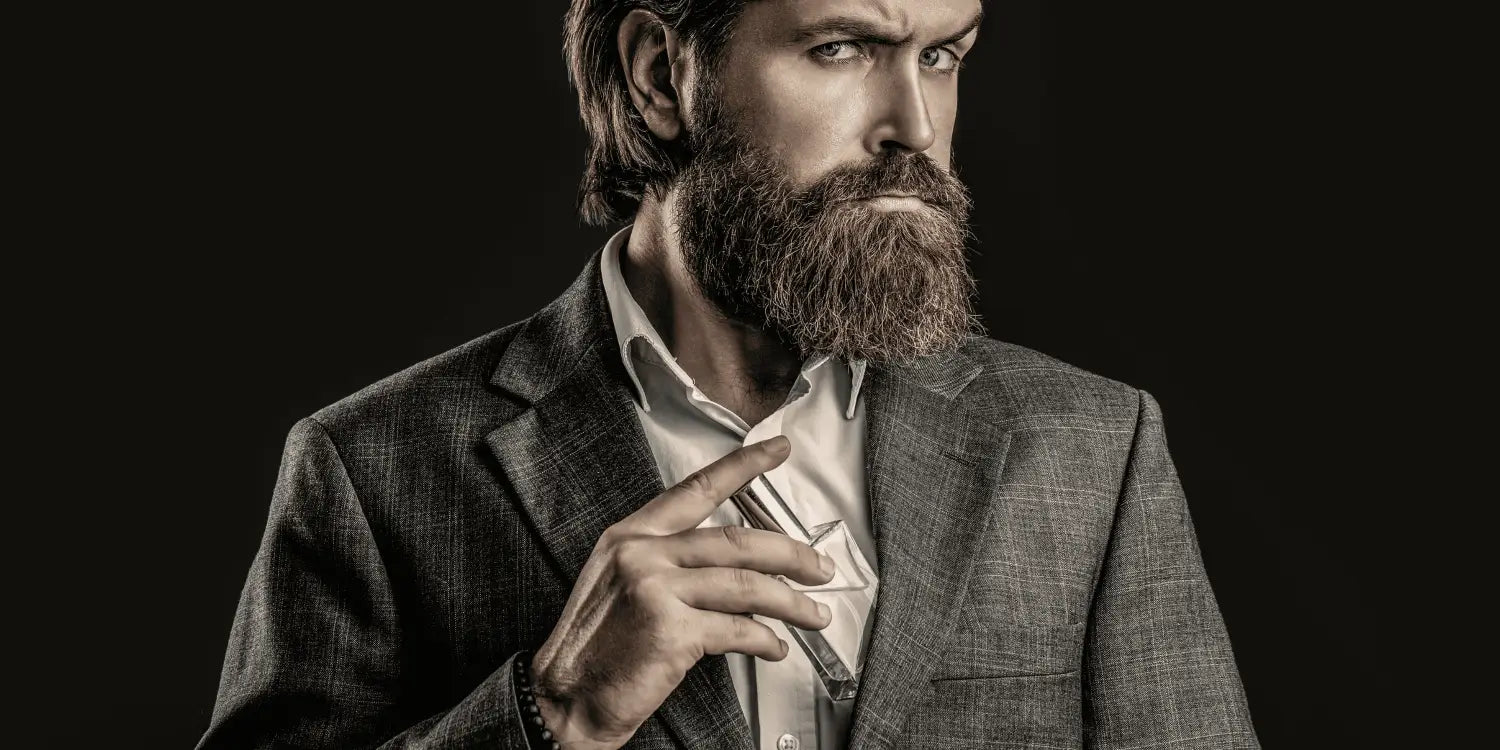 A well-groomed, smartly-dressed man confidently sporting a full, healthy beard, reflecting meticulous beard care and hygiene.