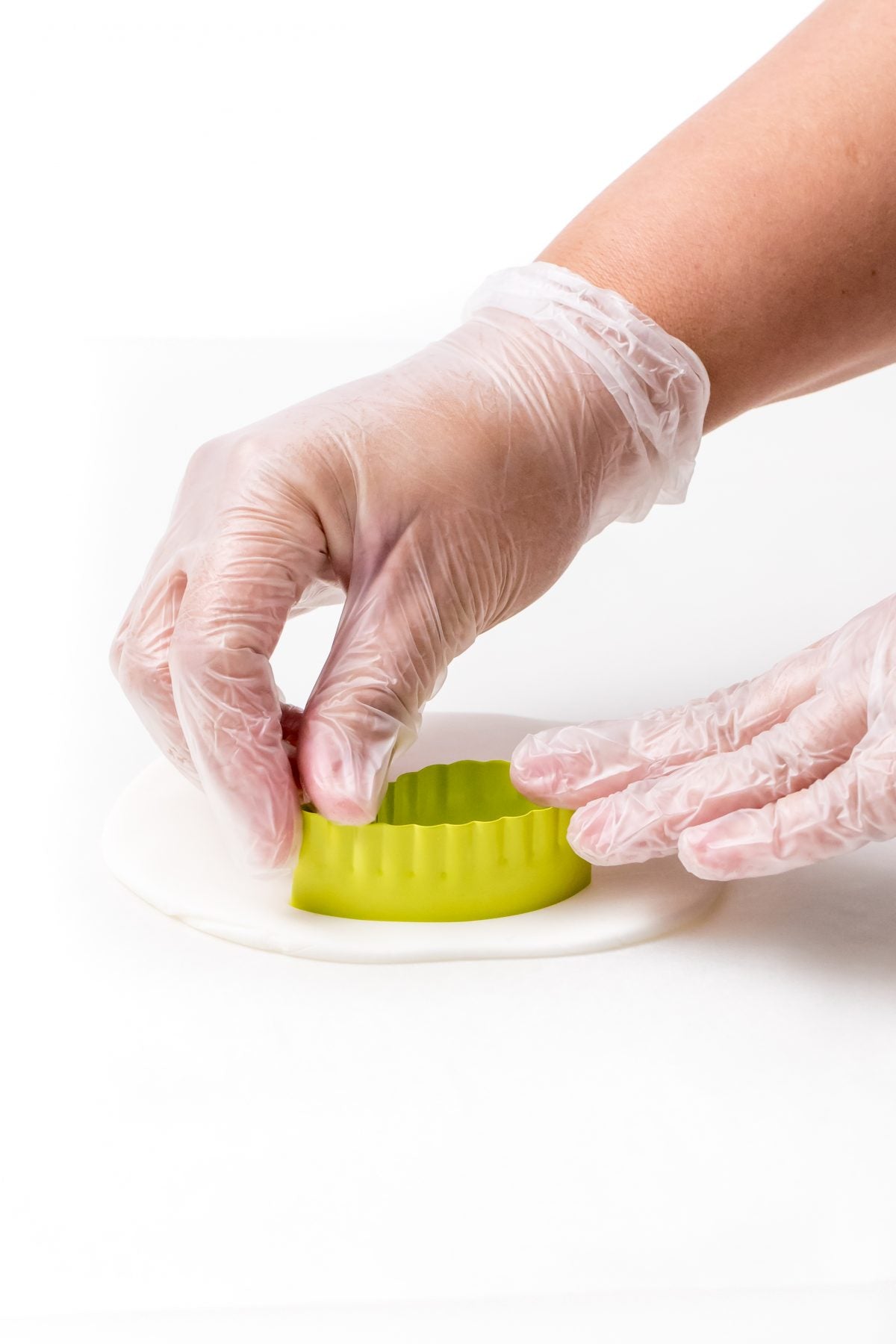 CUT EAR SHAPES IN THE FONDANT USING COOKIE CUTTERS