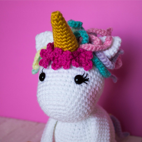 cute amigurumi unicorn head with flowers
