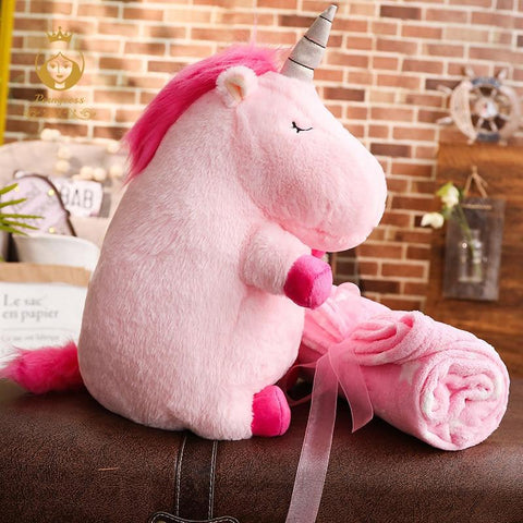 peluche licorne avec une couverture