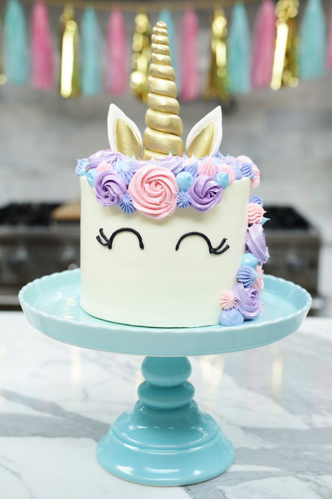 golden horn unicorn cake and decorations