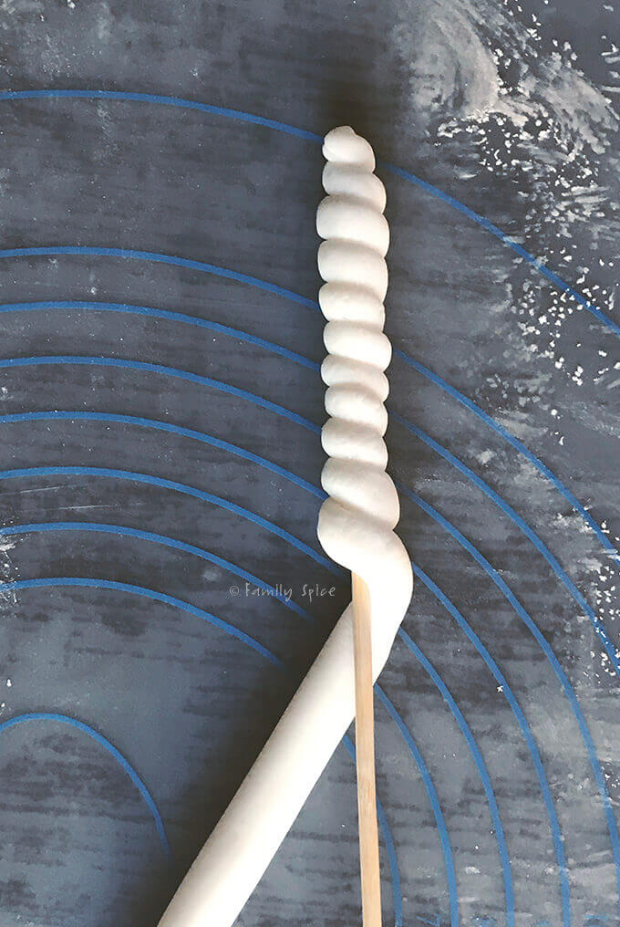 wrap the dough around the stem to make the horn