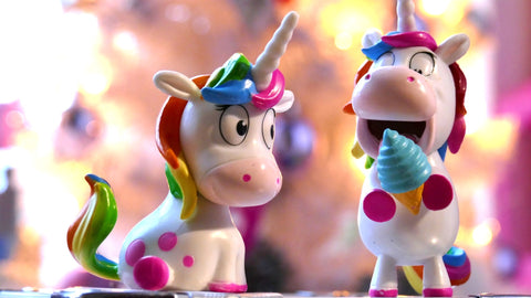 Photo of 2 unicorn toys with rainbow colors