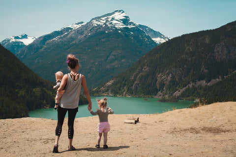 mum with two kids on an adventure in the mountains