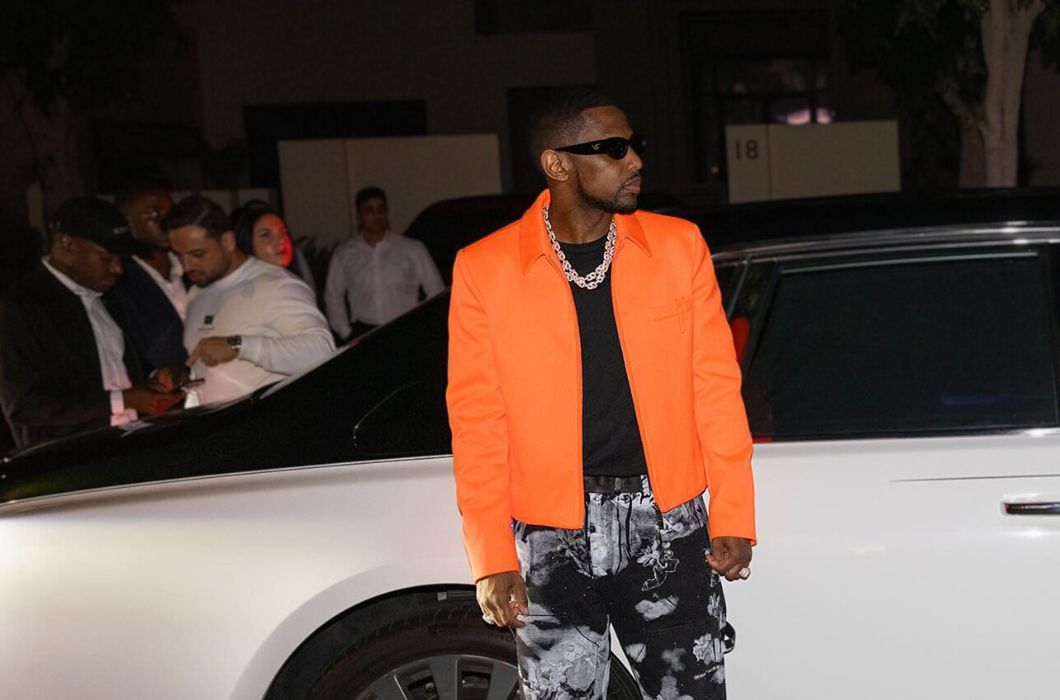 Rapper Fabolous wearing orange jacket and black sunglasses from vintage frames company