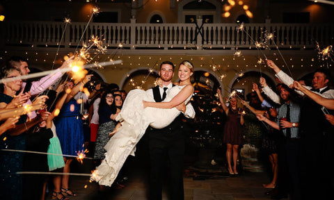Couple enjoying 36 inch sparklers for their wedding exit