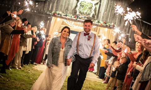 Gleaming wedding sparklers covering couple for a winter wedding