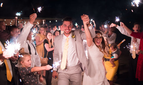 Guests lighting up the aisle with sparklers