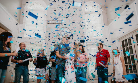 Gender Reveal with blue confetti cannons