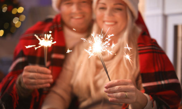 Add sparklers to your Christmas caroling experience for a beautiful bright display