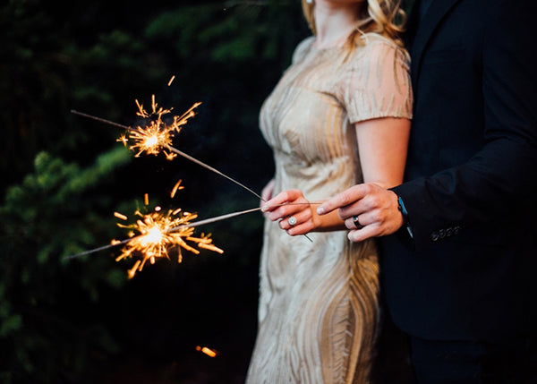 Couple Holding Sparklers to Celebrate Anniversary