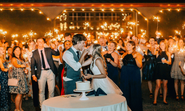 Cutting the Cake With wedding Sparklers as a beautiful photo background