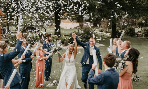 confetti cannons being used to look like snow for a winter wedding