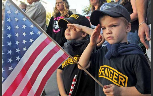 kids holding the American Flag