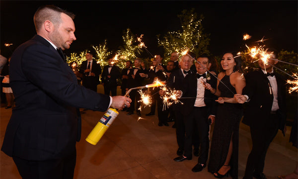 Man Lighting Multiple Wedding Sparklers