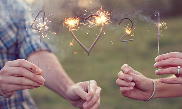 Using number sparklers for a save the date photo for a wedding