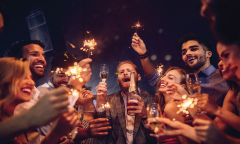 Guests doing a wedding toast with sparklers