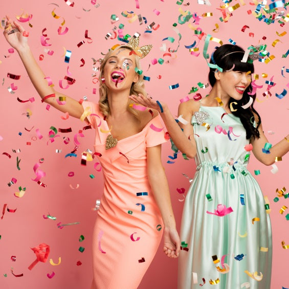 Two Young Women Under a Confetti Cannon