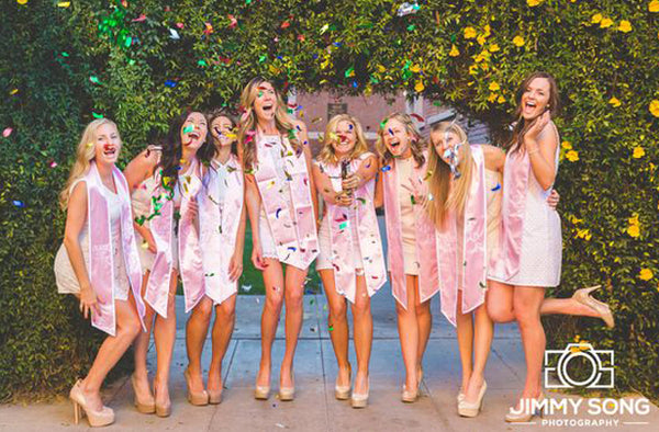 Female College Students Celebrating Graduation with Confetti